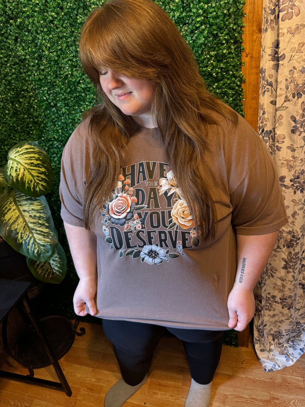 Model wearing Have the day you deserve floral design on espresso