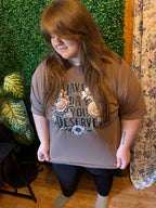 Model wearing Have the day you deserve floral design on espresso