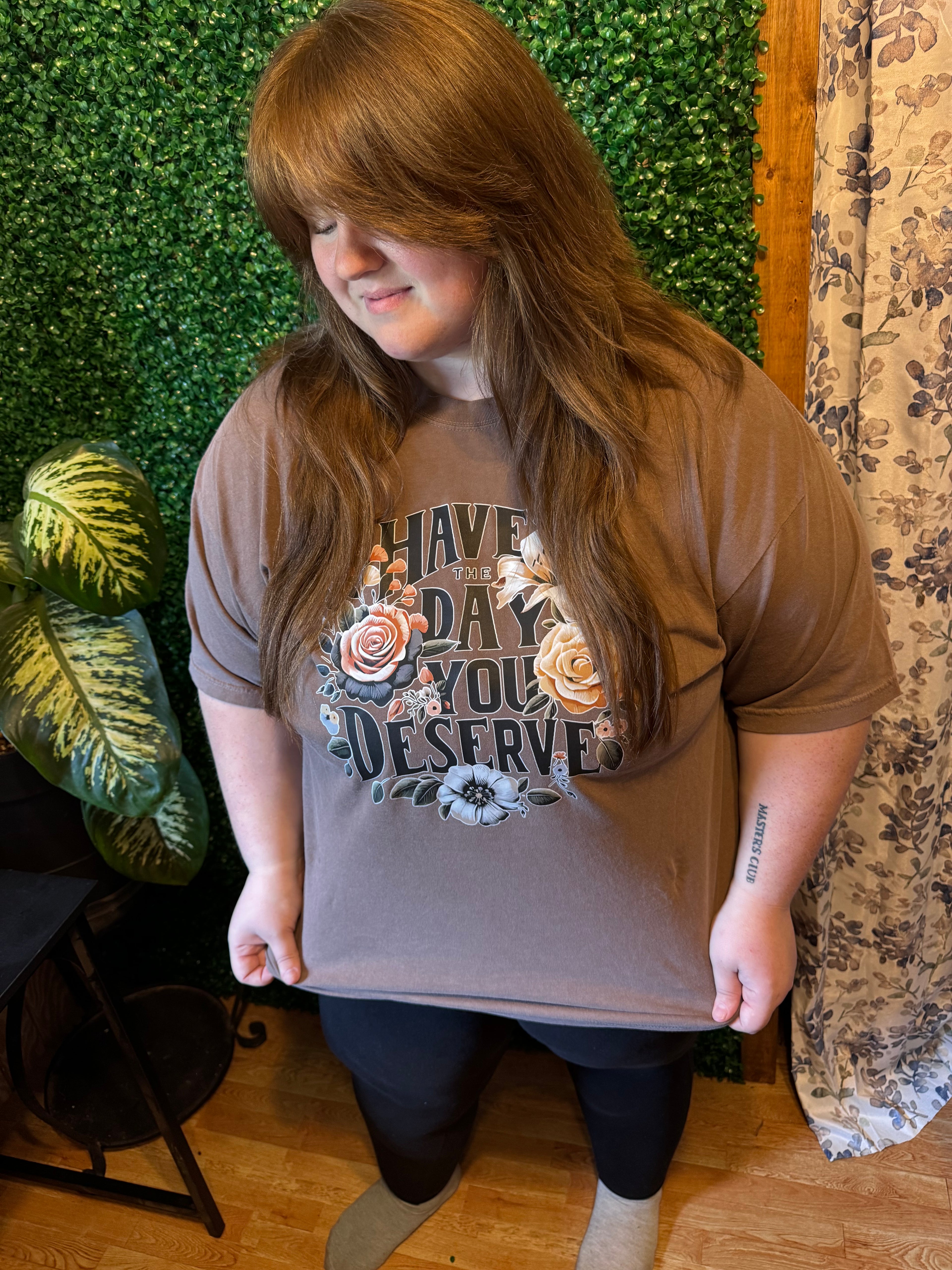 Model wearing Have the day you deserve floral design on espresso