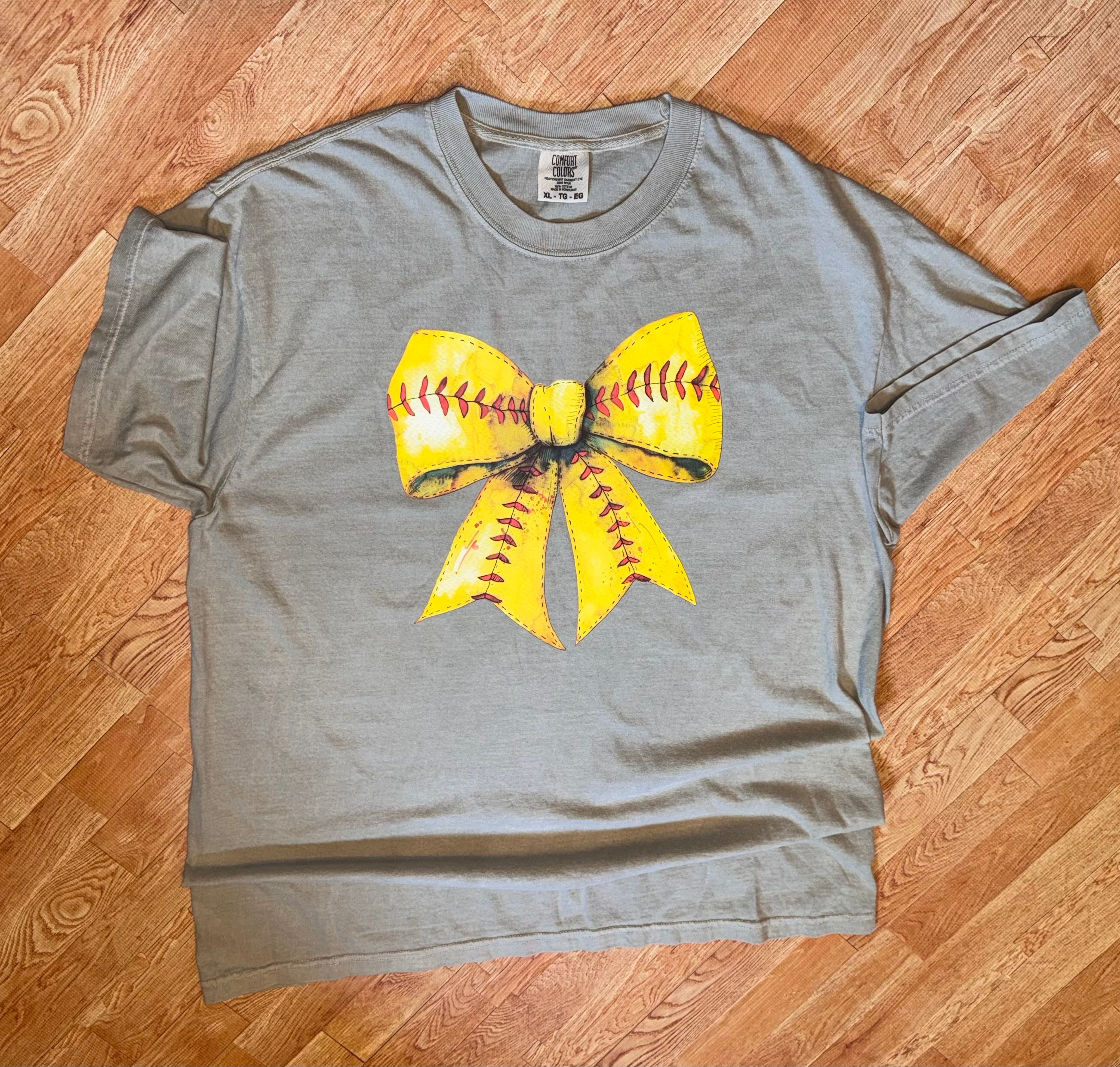 Sandstone color comfort colors tshirt with softball bow graphic design